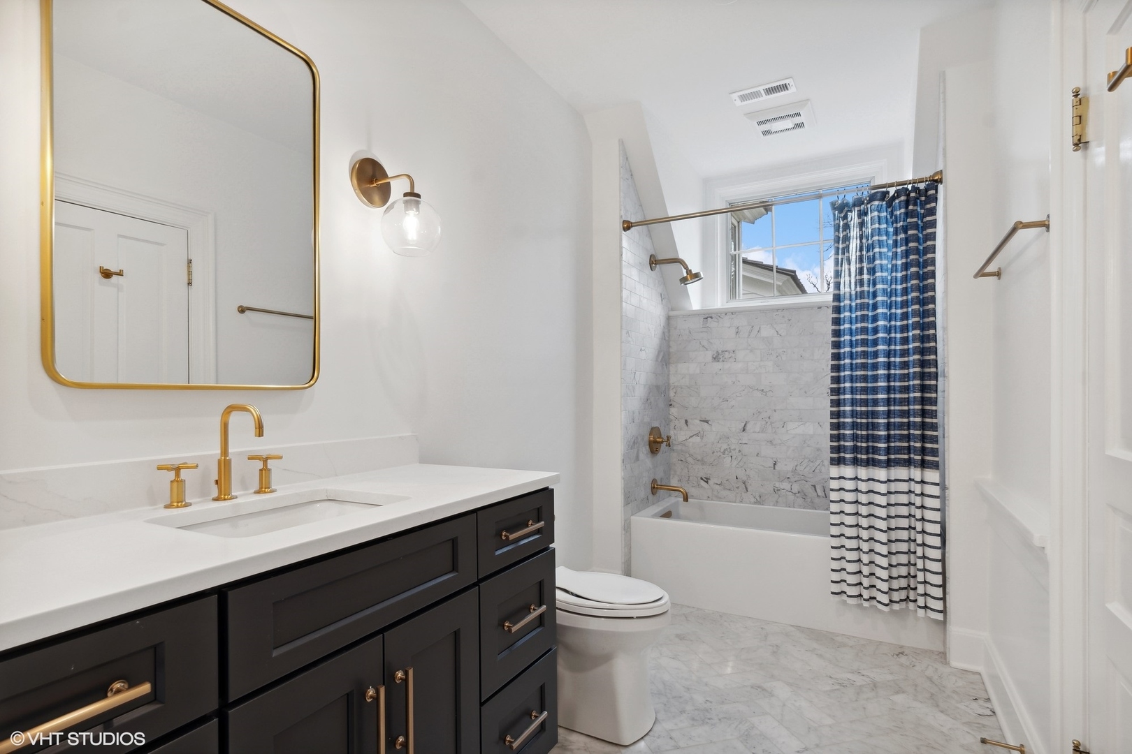 1241 Edgewood Road Lake Forest, IL 60045 - Photo 32 of 46 a bathroom with a sink a toilet and shower