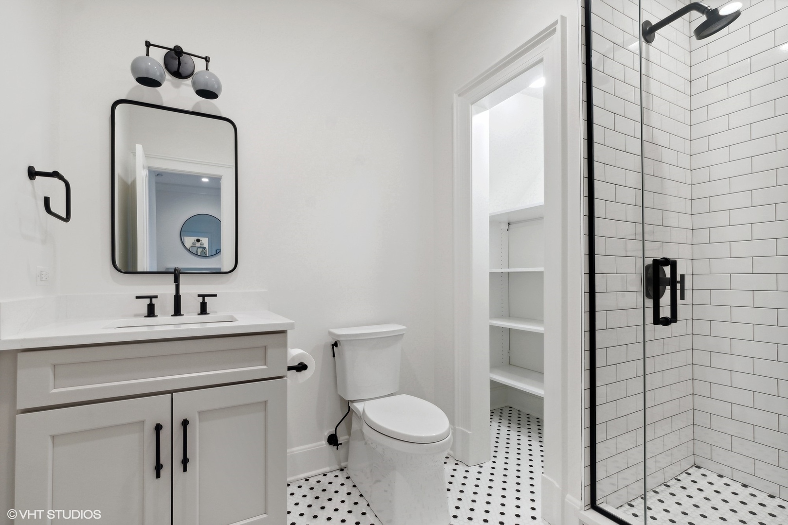 1241 Edgewood Road Lake Forest, IL 60045 - Photo 35 of 46 a bathroom with a sink toilet and shower