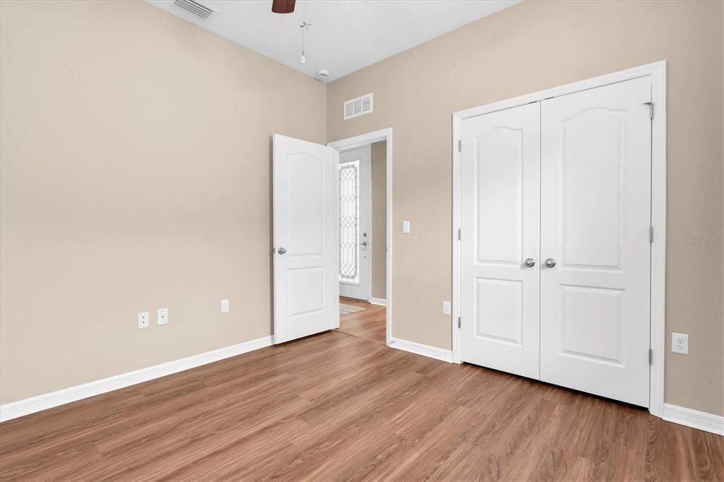 11236 Merganser Way New Port Richey, FL 34654 - Photo 15 of 41 a view of an empty room with wooden floor