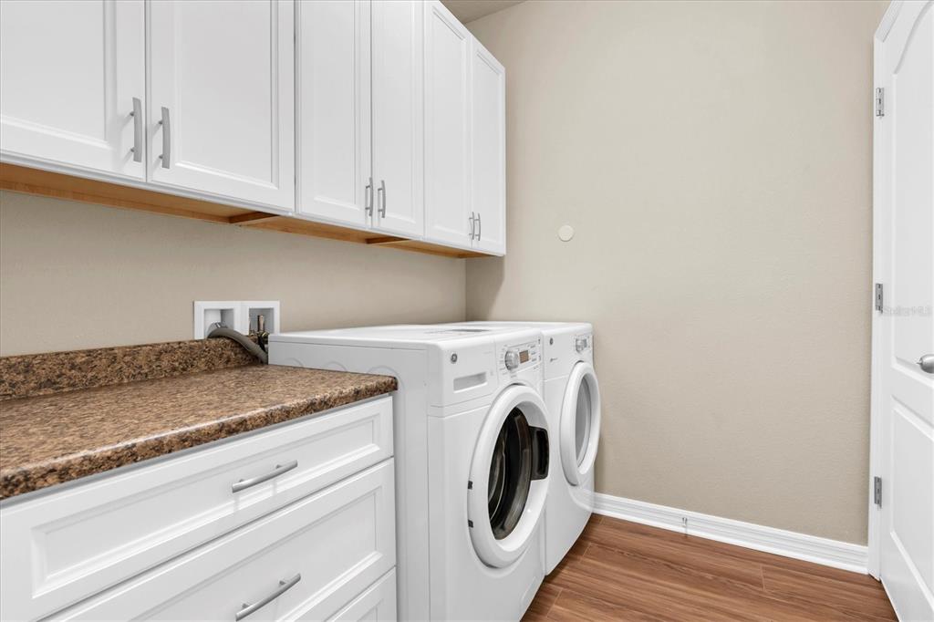 11236 Merganser Way New Port Richey, FL 34654 - Photo 19 of 41 a utility room with dryer and washer