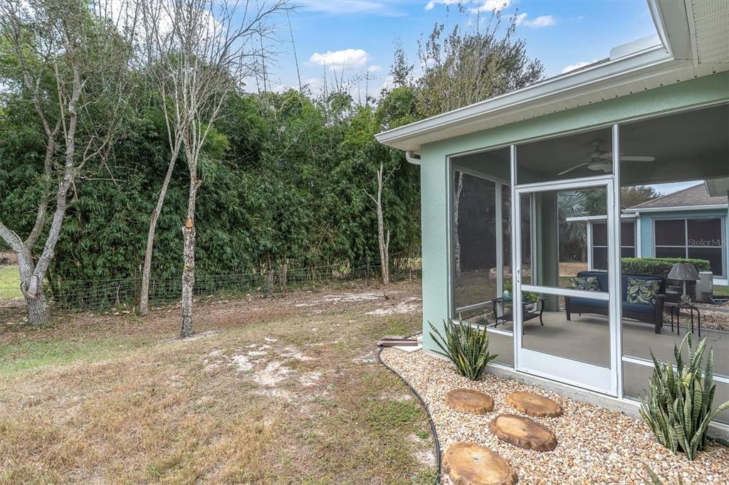 11236 Merganser Way New Port Richey, FL 34654 - Photo 22 of 41 a view of a chair and table in backyard of the house