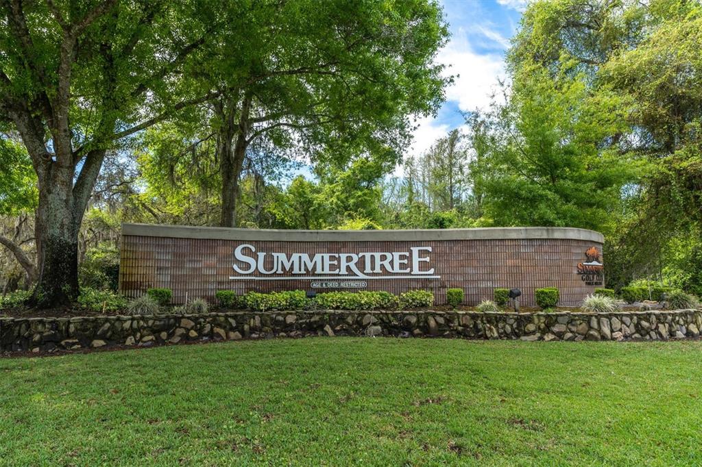 11236 Merganser Way New Port Richey, FL 34654 - Photo 29 of 41 a view of a street sign under a large tree