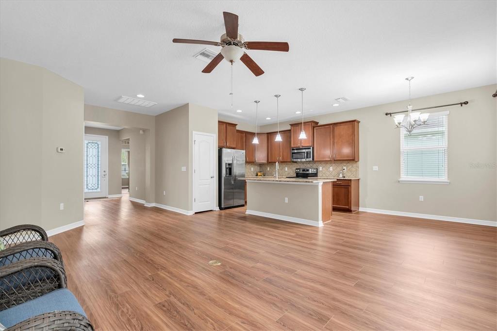 11236 Merganser Way New Port Richey, FL 34654 - Photo 3 of 41 a view of a kitchen with wooden floor and a window