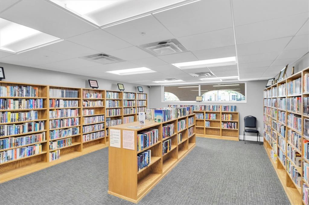 11236 Merganser Way New Port Richey, FL 34654 - Photo 39 of 41 a room with lots of furniture and a book shelf