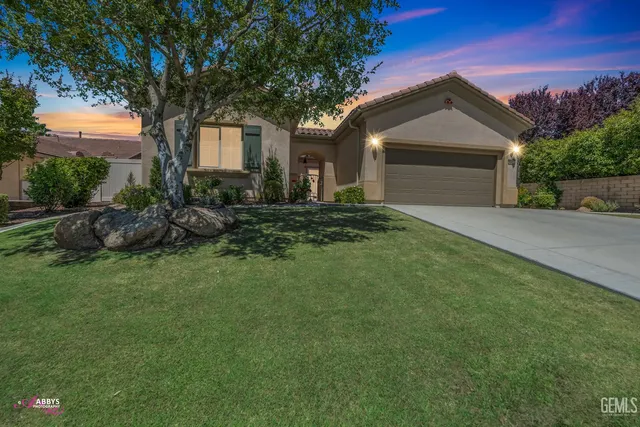 a front view of a house with sitting space
