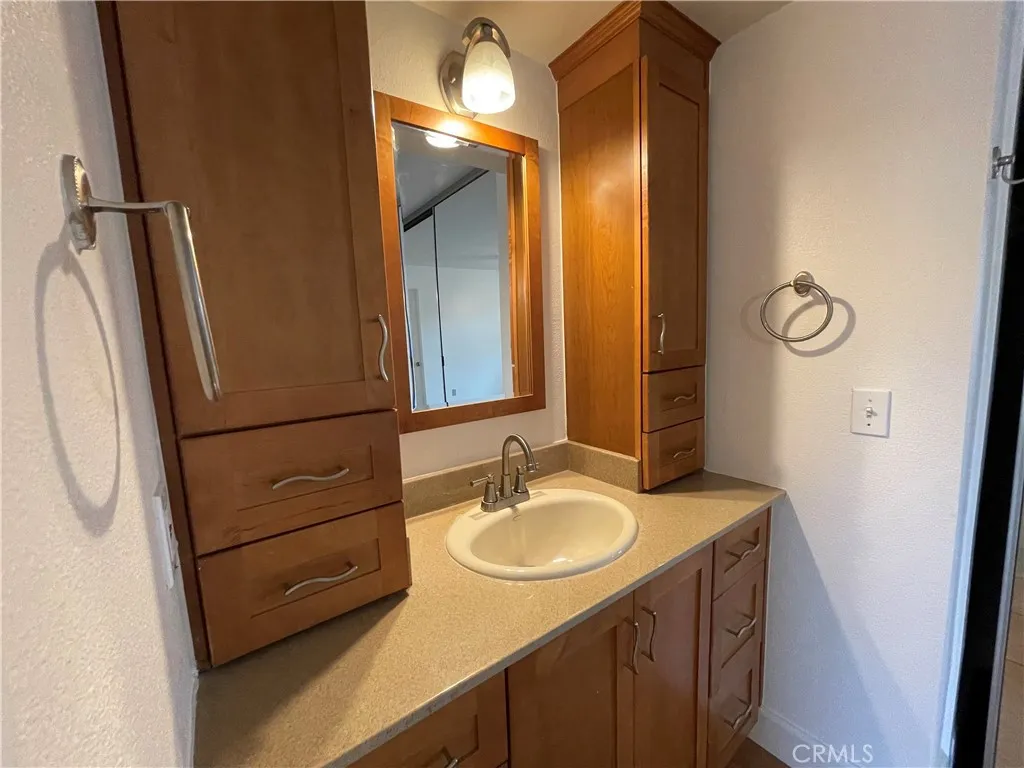 12555 Euclid Street, Unit 21 Garden Grove, CA 92843 - Photo 6 of 7 a bathroom with a sink and a mirror