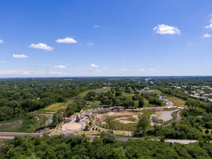 a view of grassy field with trees