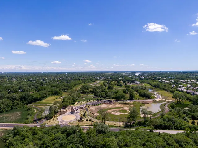 a view of grassy field with trees