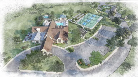 an aerial view of a house with outdoor space