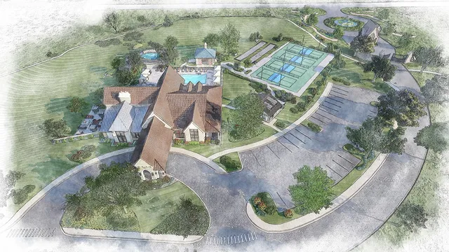 an aerial view of a house with outdoor space