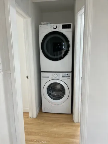 a view of a hallway with washer and dryer