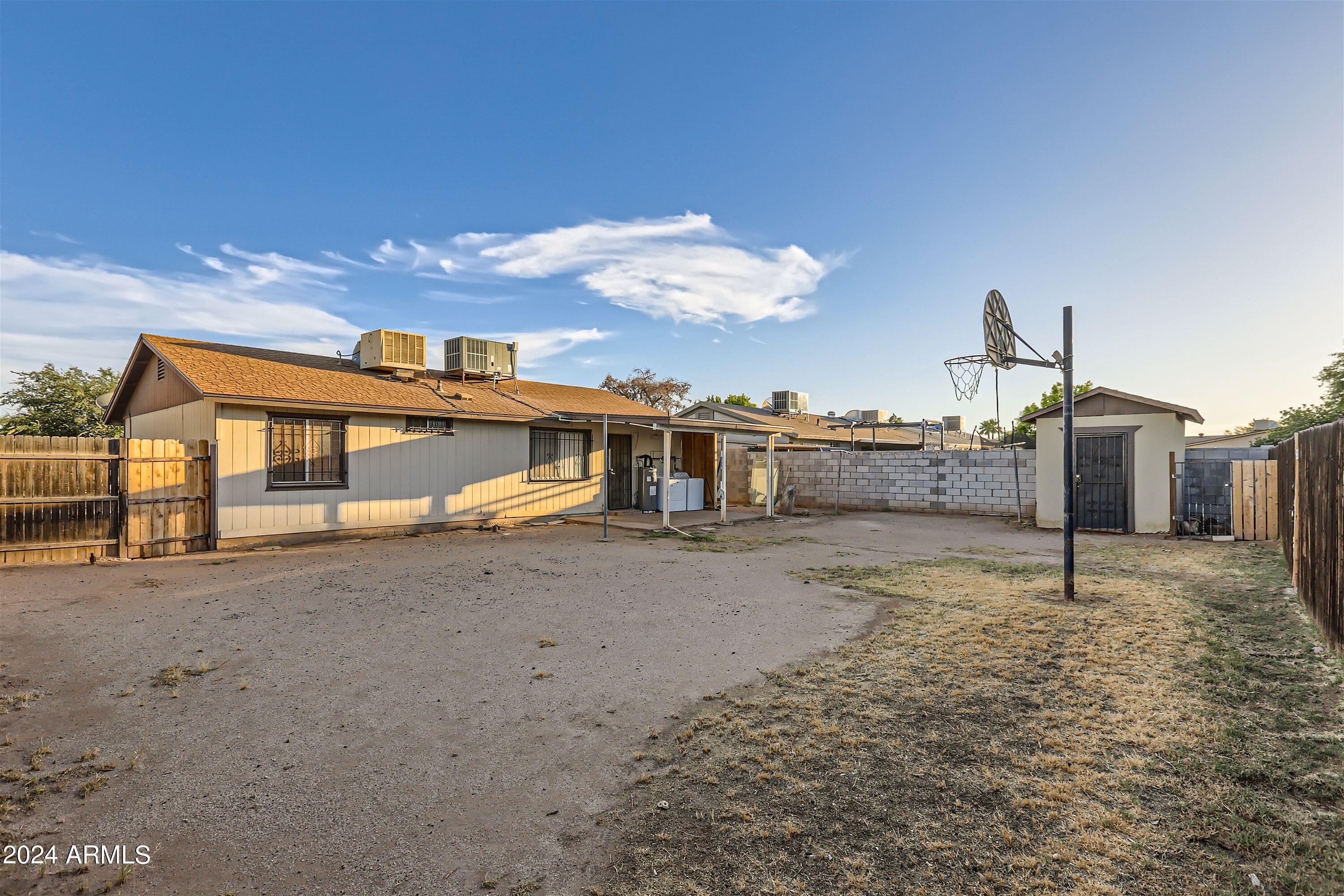 5202 West Berkeley Road Phoenix, AZ 85035 - Photo 12 of 12 a view of a dirt road and a building