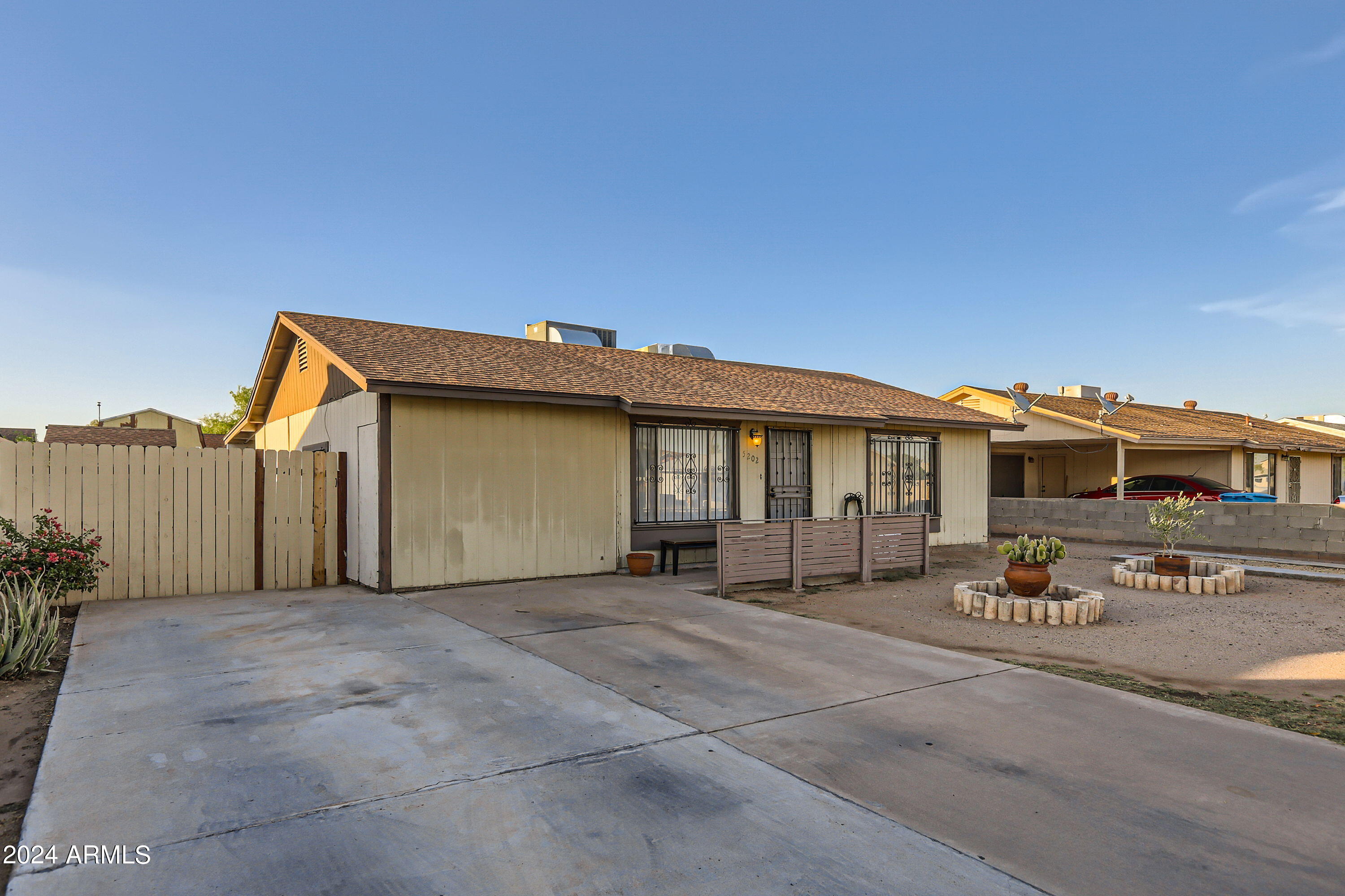 5202 West Berkeley Road Phoenix, AZ 85035 - Photo 2 of 12 a view of a house with a large space in front of it