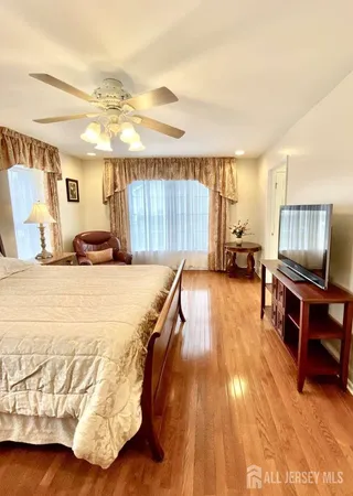 a bed room with a bed and a television