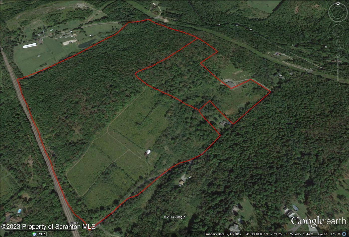 305 Benton Road Dalton, PA 18414 - Photo 2 of 5 an aerial view of a residential houses with outdoor space