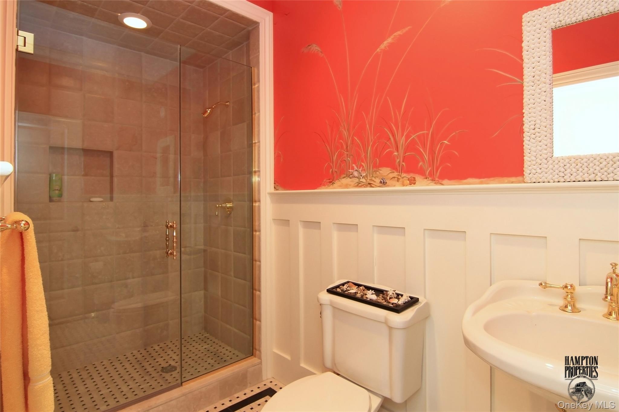 29 Cedar Lane Remsenburg, NY 11960 - Photo 11 of 27 a bathroom with a sink a mirror and a shower