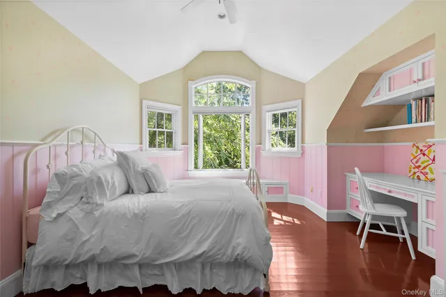 a living room with a bed furniture and a window