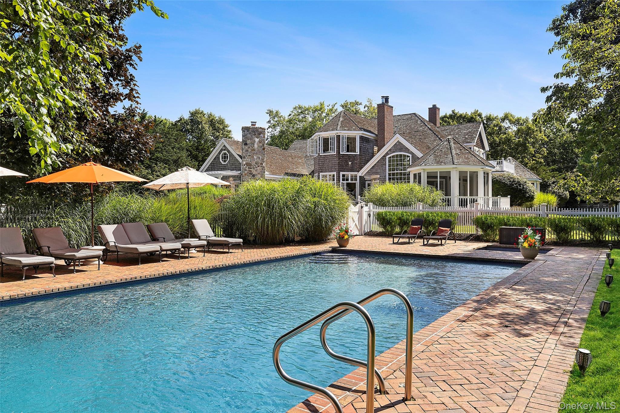 29 Cedar Lane Remsenburg, NY 11960 - Photo 2 of 27 a view of swimming pool with outdoor seating and plants