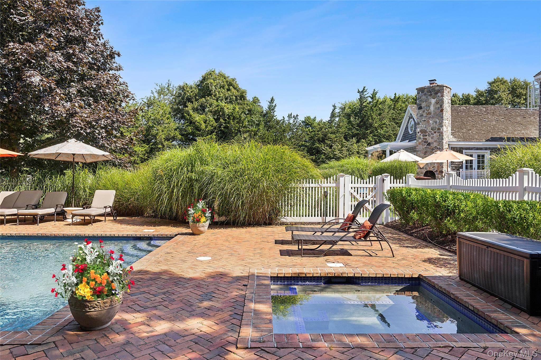 29 Cedar Lane Remsenburg, NY 11960 - Photo 25 of 27 a view of a patio with chairs and plants