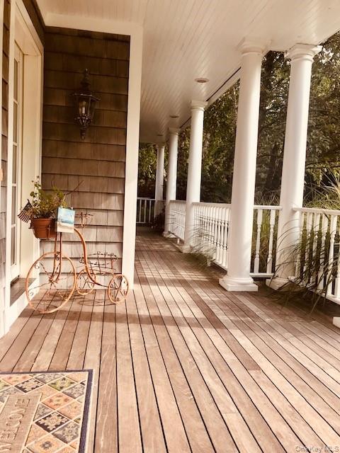 29 Cedar Lane Remsenburg, NY 11960 - Photo 26 of 27 a view of outdoor space with wooden floor and windows