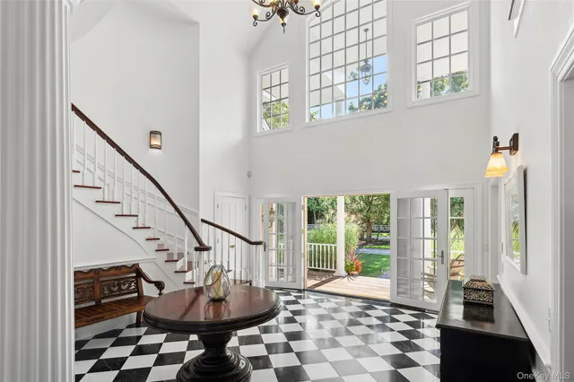 a view of an entryway with wooden floor