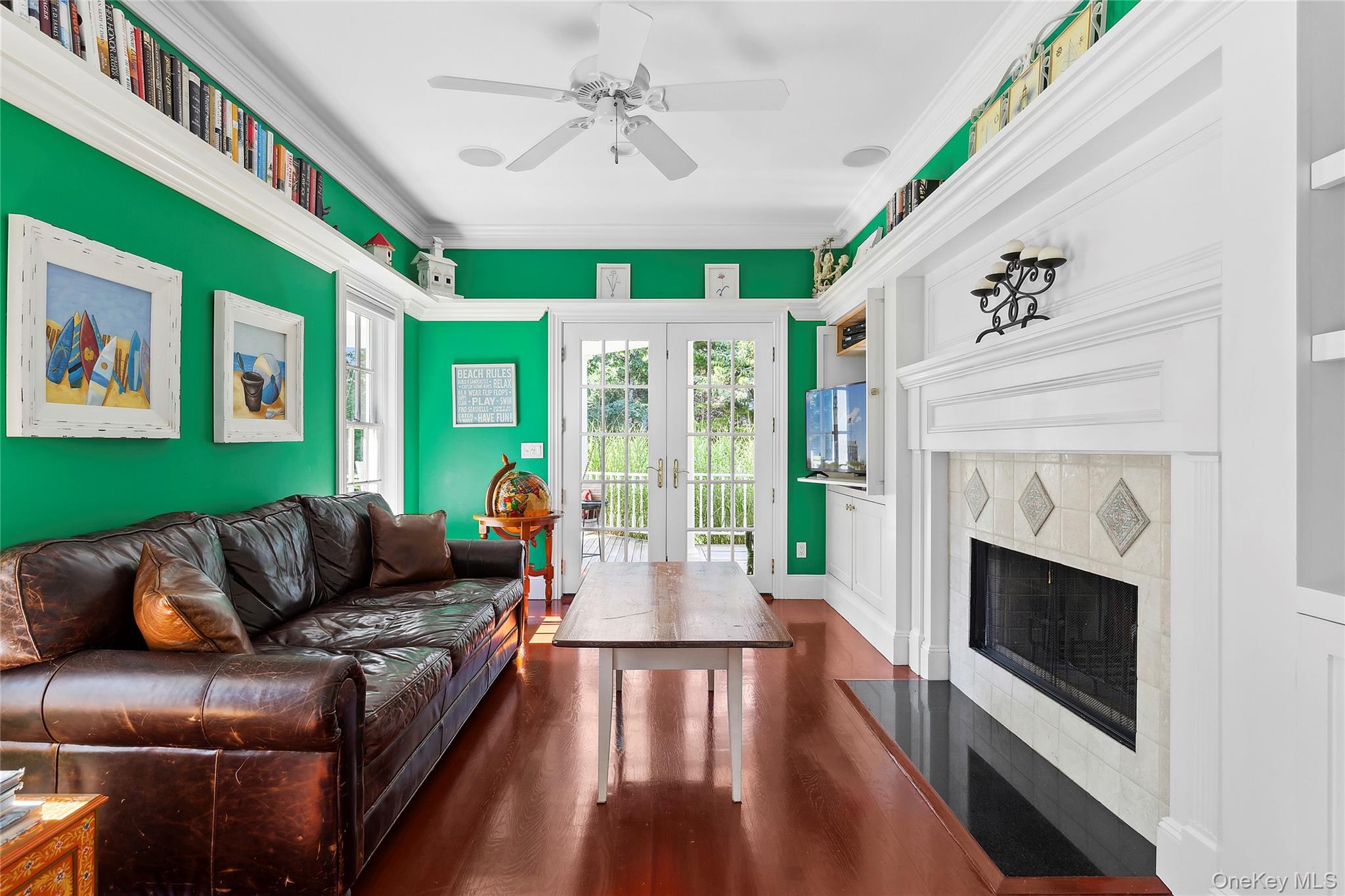 29 Cedar Lane Remsenburg, NY 11960 - Photo 7 of 27 a living room with furniture and a fireplace