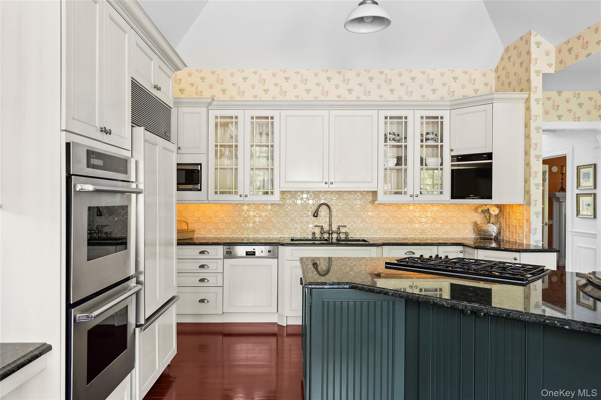 29 Cedar Lane Remsenburg, NY 11960 - Photo 10 of 27 a kitchen with stainless steel appliances a sink stove and refrigerator