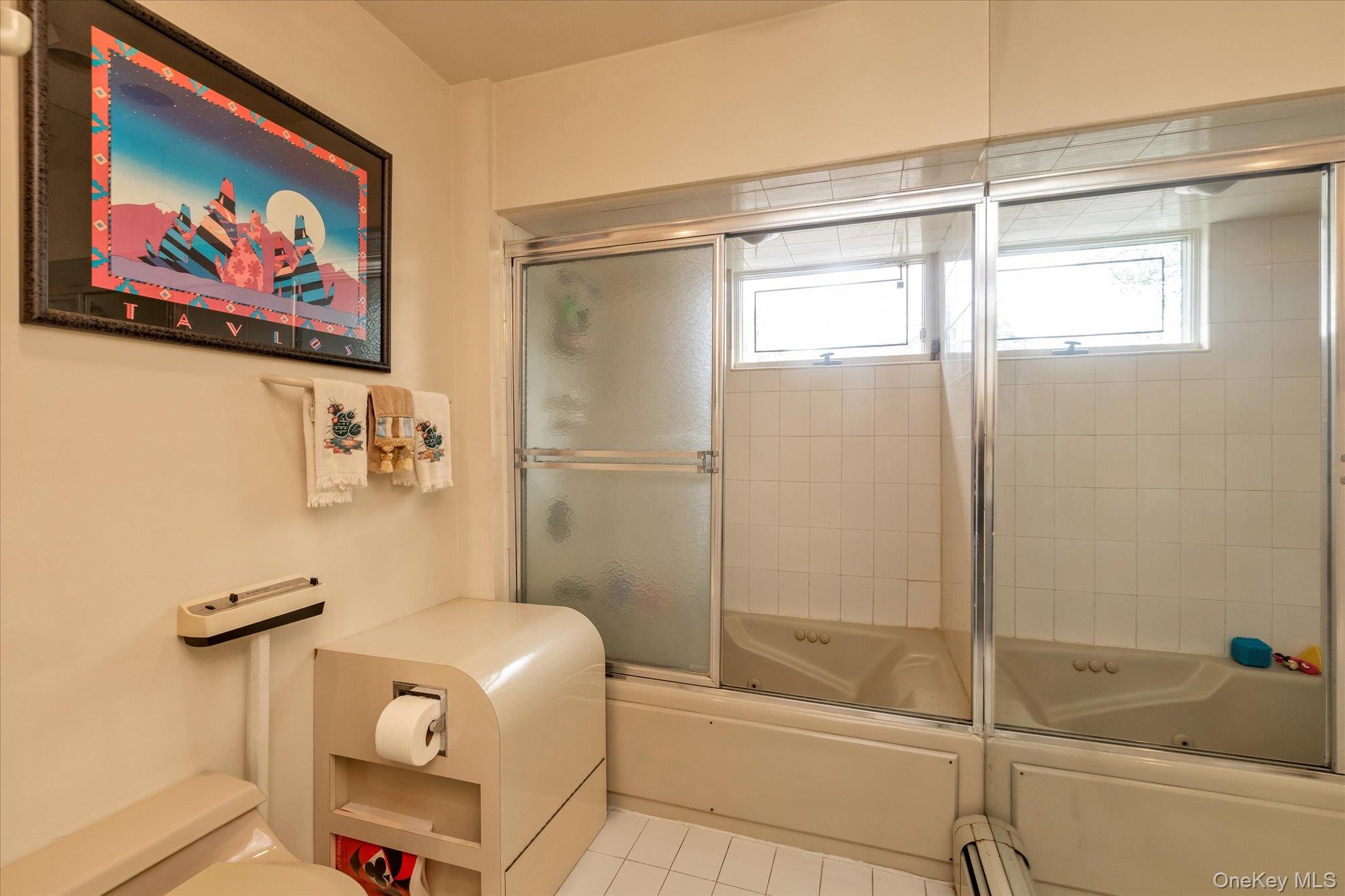 1055 Cedarhurst Street Valley Stream, NY 11581 - Photo 19 of 27 a bathroom with a shower and a toilet