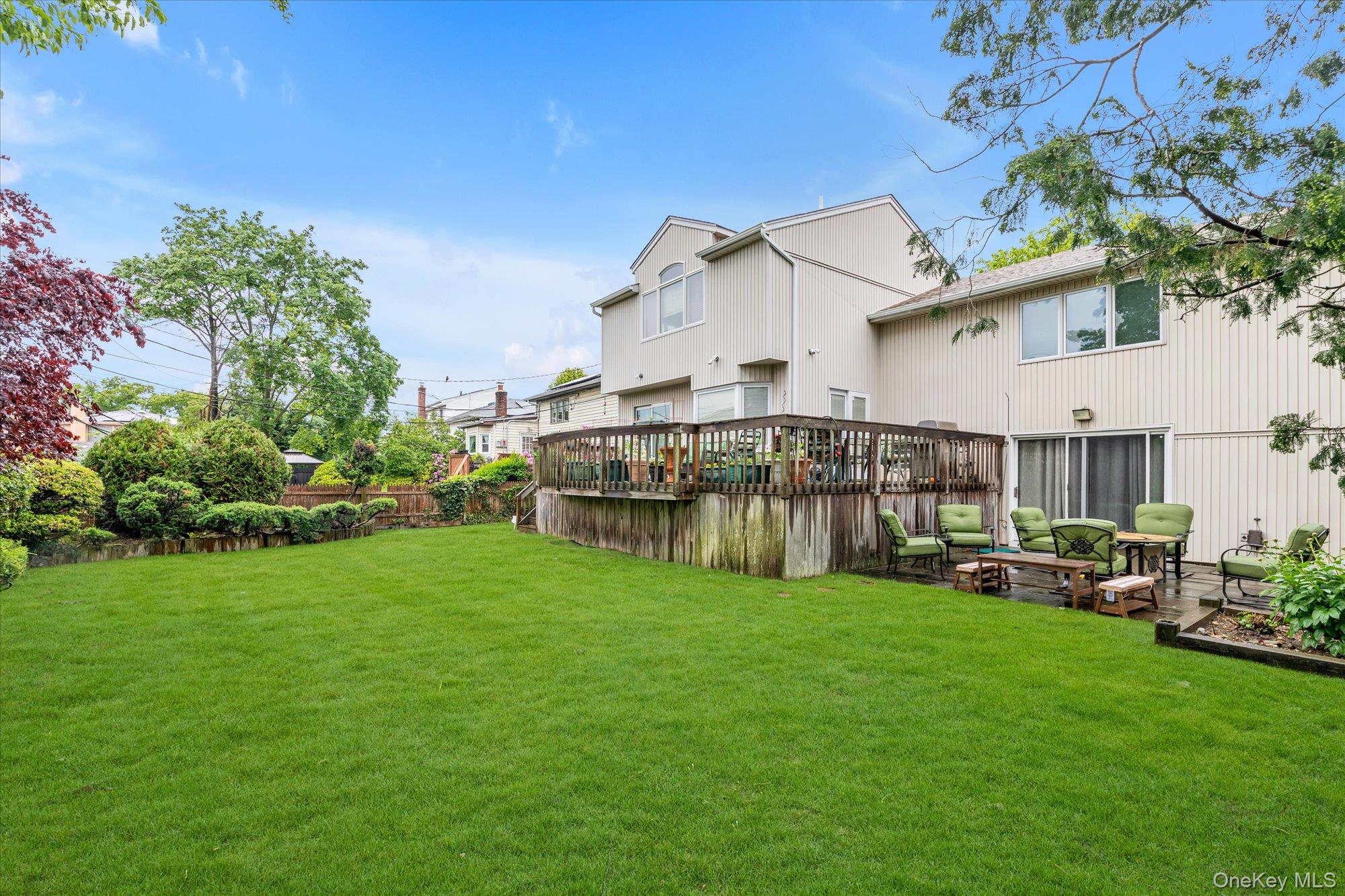 1055 Cedarhurst Street Valley Stream, NY 11581 - Photo 25 of 27 a view of a house with a yard porch and sitting area