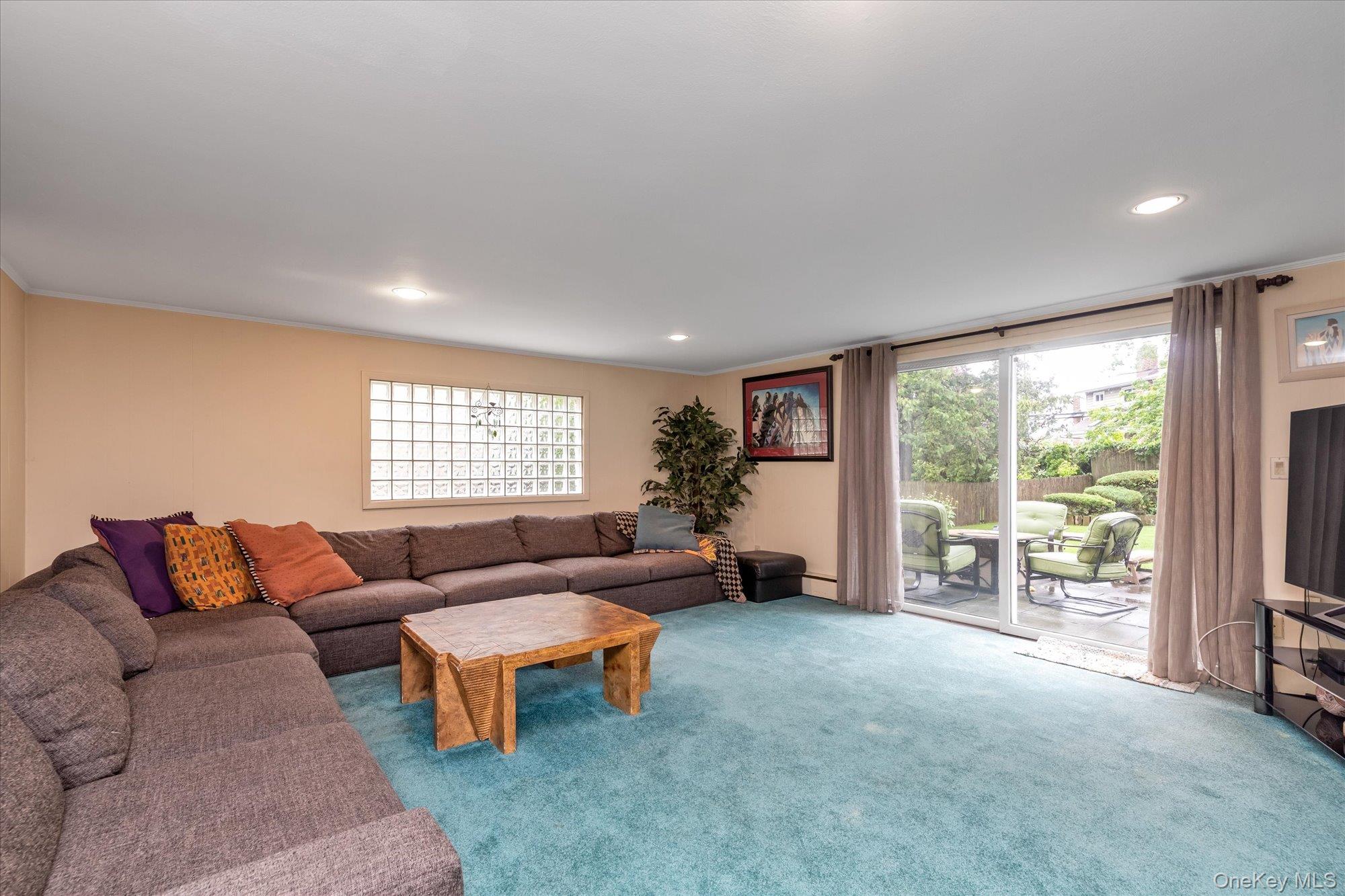 1055 Cedarhurst Street Valley Stream, NY 11581 - Photo 10 of 27 a living room with furniture and a large window