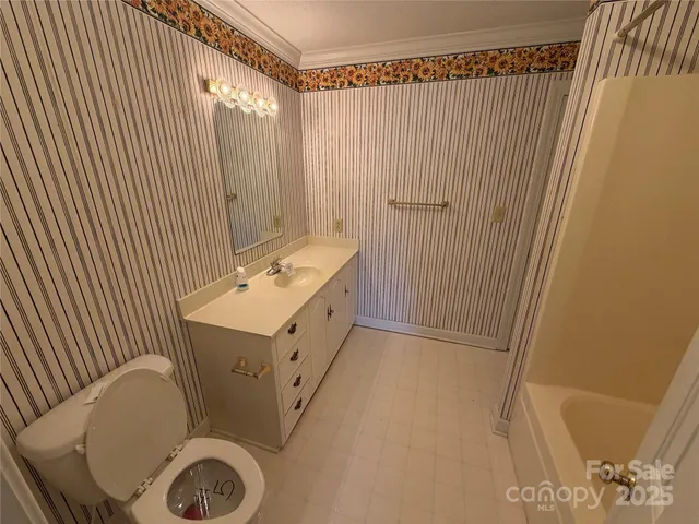 a bathroom with a tub and a shower curtain