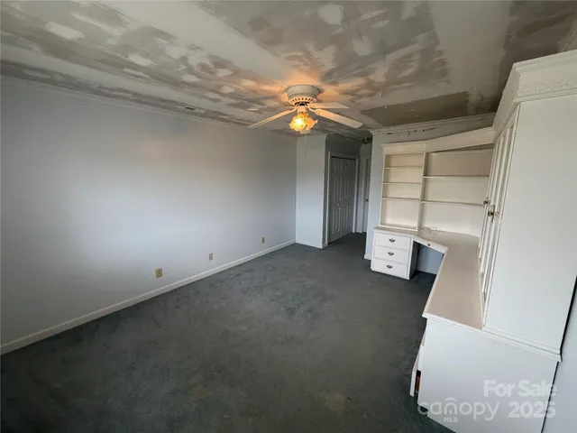 a bathroom with a granite countertop sink a mirror and a shower