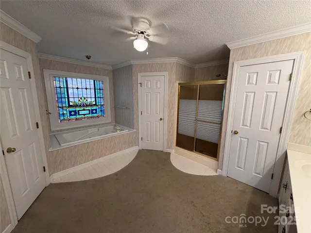 a spacious bathroom with a double vanity sink and a mirror