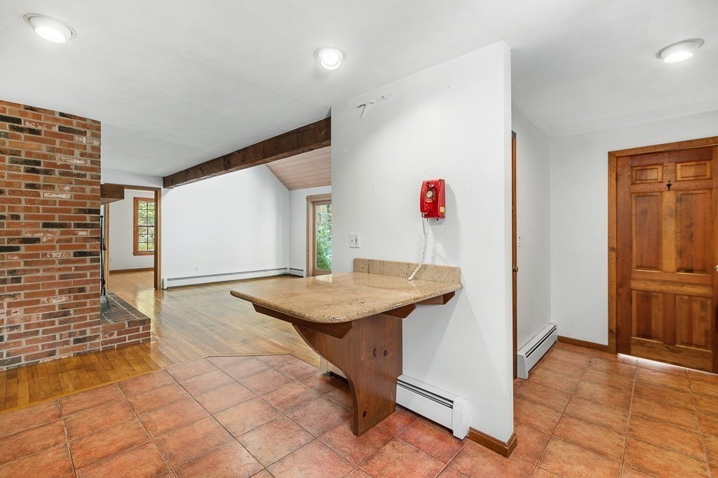 10 Hidden Ledge Road Manchester, MA 01944 - Photo 11 of 40 a view of a hallway with dining area