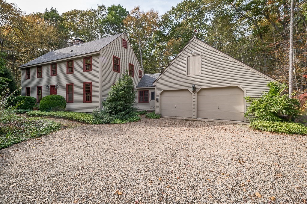 10 Hidden Ledge Road Manchester, MA 01944 - Photo 2 of 40 a view of house with garden and garage