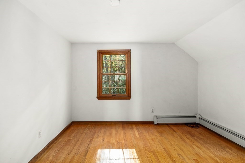 10 Hidden Ledge Road Manchester, MA 01944 - Photo 23 of 40 a view of a room with wooden floor and window