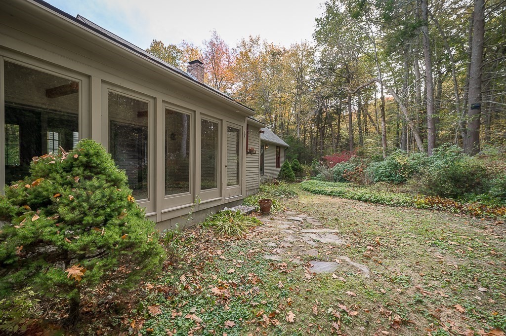 10 Hidden Ledge Road Manchester, MA 01944 - Photo 29 of 40 a house with trees in front of it