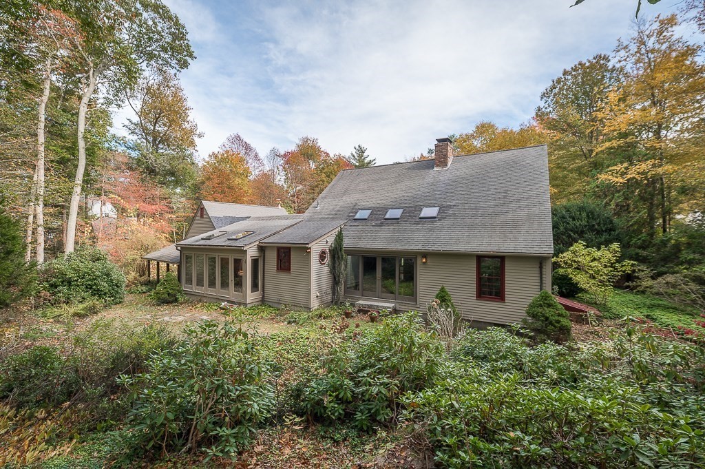 10 Hidden Ledge Road Manchester, MA 01944 - Photo 30 of 40 a aerial view of a house with yard porch and furniture
