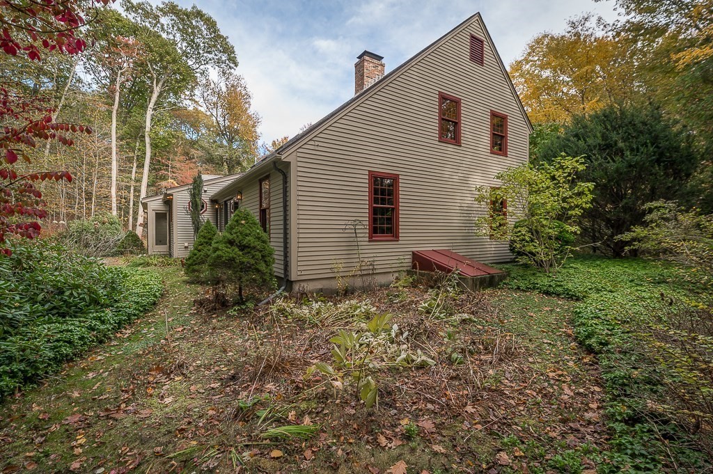10 Hidden Ledge Road Manchester, MA 01944 - Photo 33 of 40 a view of a house with a yard
