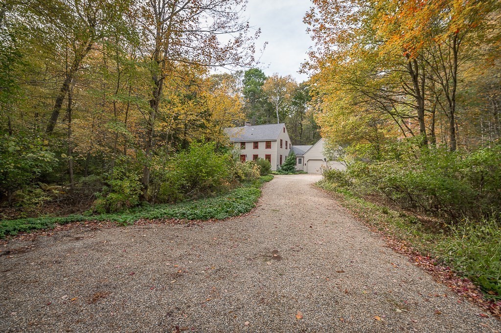 10 Hidden Ledge Road Manchester, MA 01944 - Photo 34 of 40 a view of a road with plants and large trees