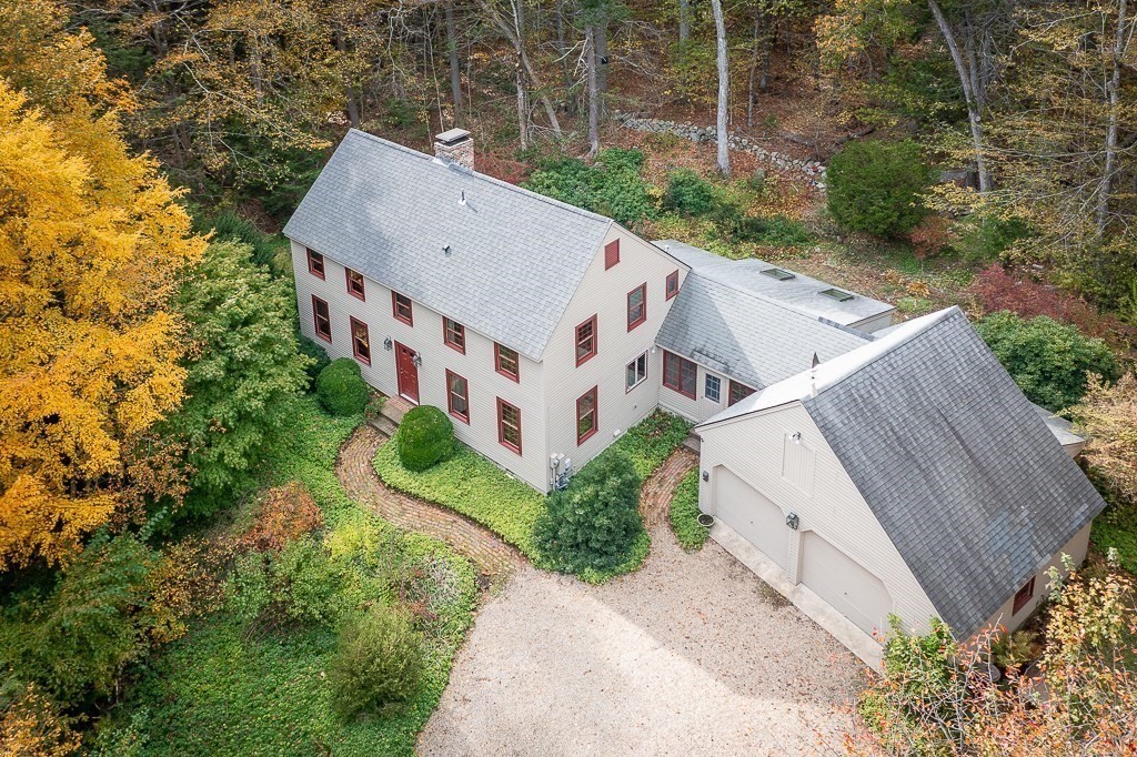 10 Hidden Ledge Road Manchester, MA 01944 - Photo 5 of 40 an aerial view of a house with a yard and large trees