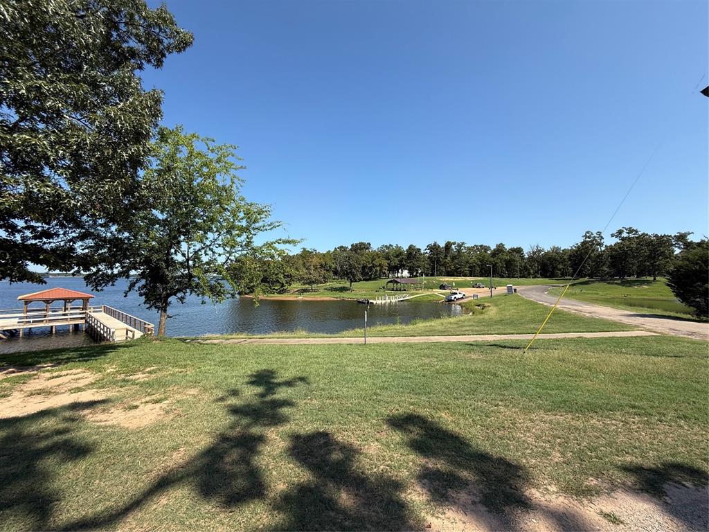 0 Waterfront Row Quitman, TX 75783 - Photo 13 of 21 a view of a lake from a yard