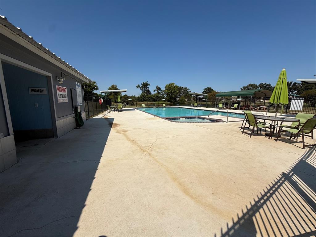 0 Waterfront Row Quitman, TX 75783 - Photo 19 of 21 a view of a swimming pool with a lounge chair