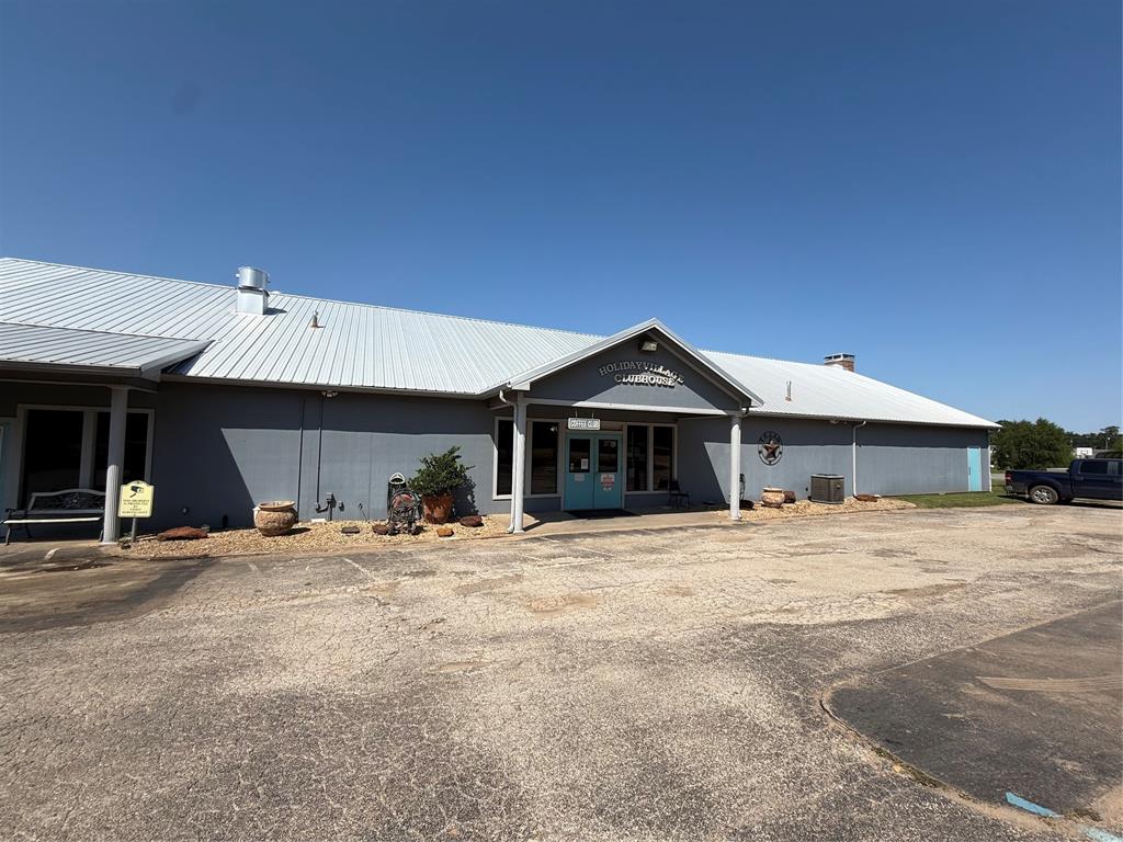 0 Waterfront Row Quitman, TX 75783 - Photo 21 of 21 a front view of a house with two trees in front of it