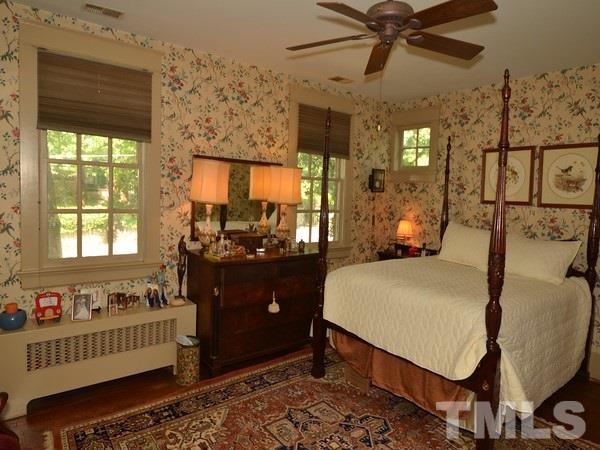 2201 Beechridge Road Raleigh, NC 27608 - Photo 14 of 23 a bed room with a bed and a window
