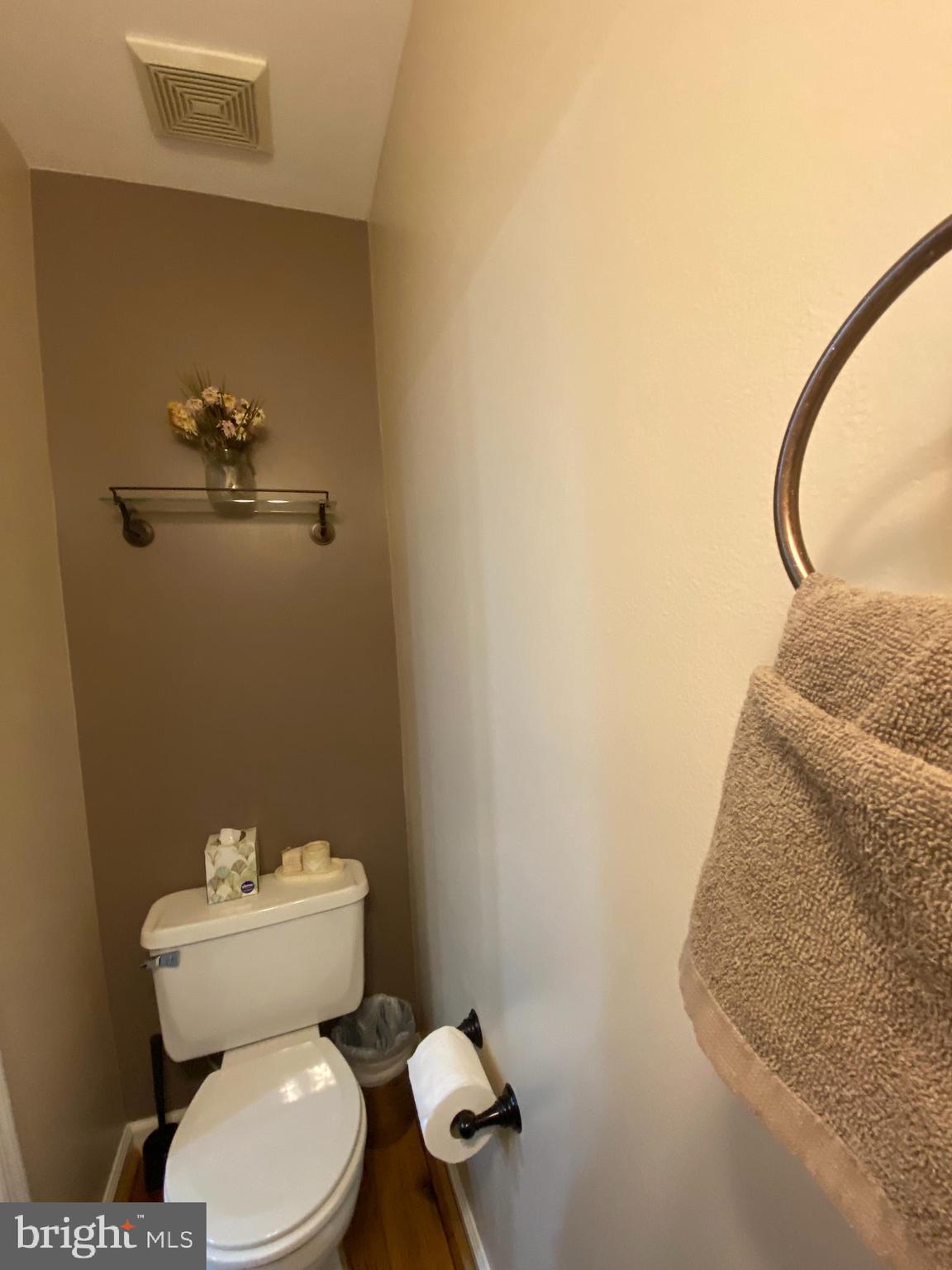 8523 Gambel Oak Drive Springfield, VA 22153 - Photo 30 of 41 a bathroom with a toilet and a mirror