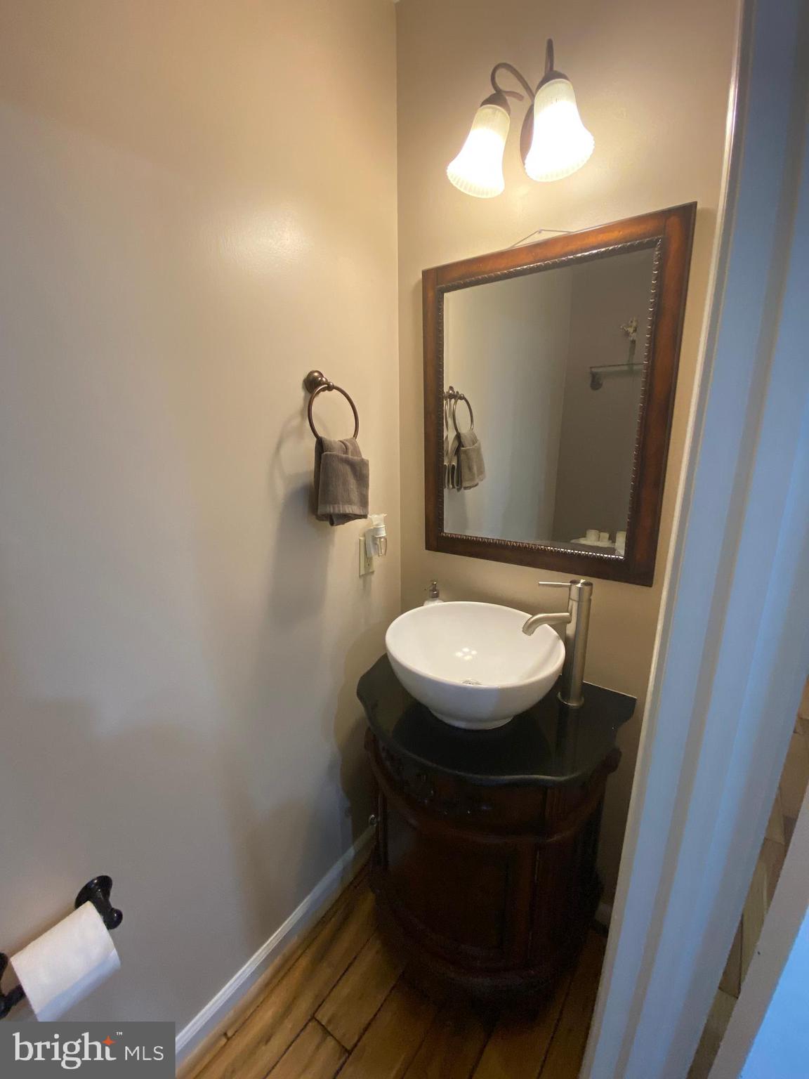 8523 Gambel Oak Drive Springfield, VA 22153 - Photo 32 of 41 a bathroom with a toilet and a mirror