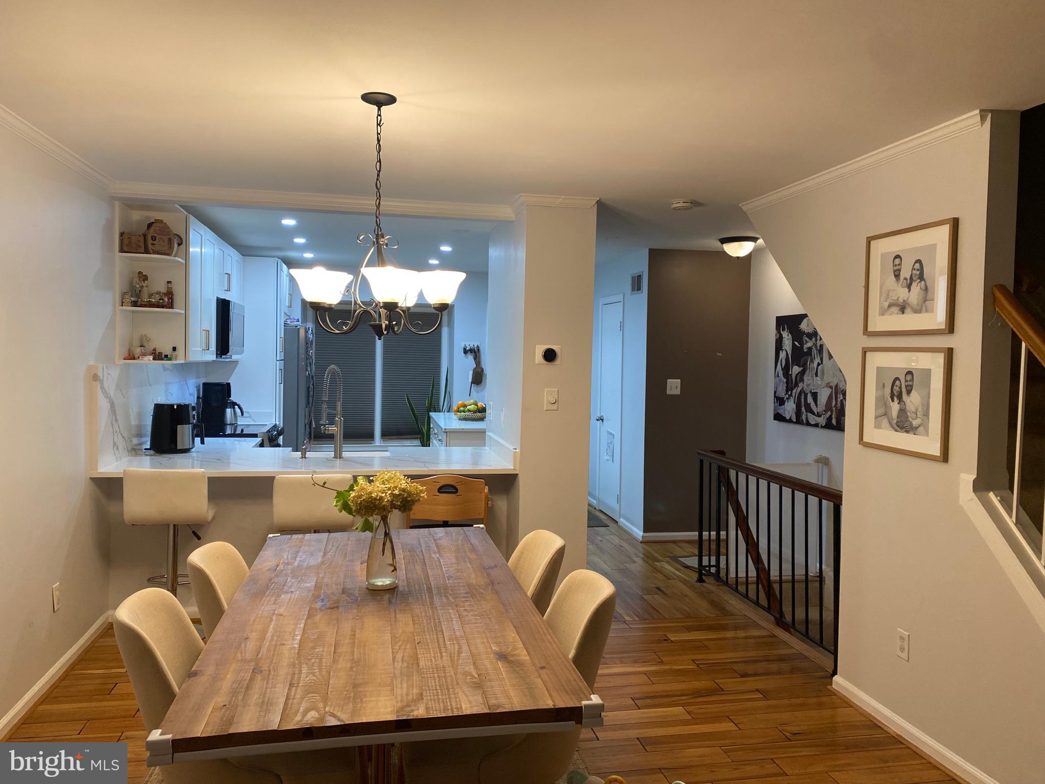 8523 Gambel Oak Drive Springfield, VA 22153 - Photo 38 of 41 a view of a dining room with furniture window and wooden floor