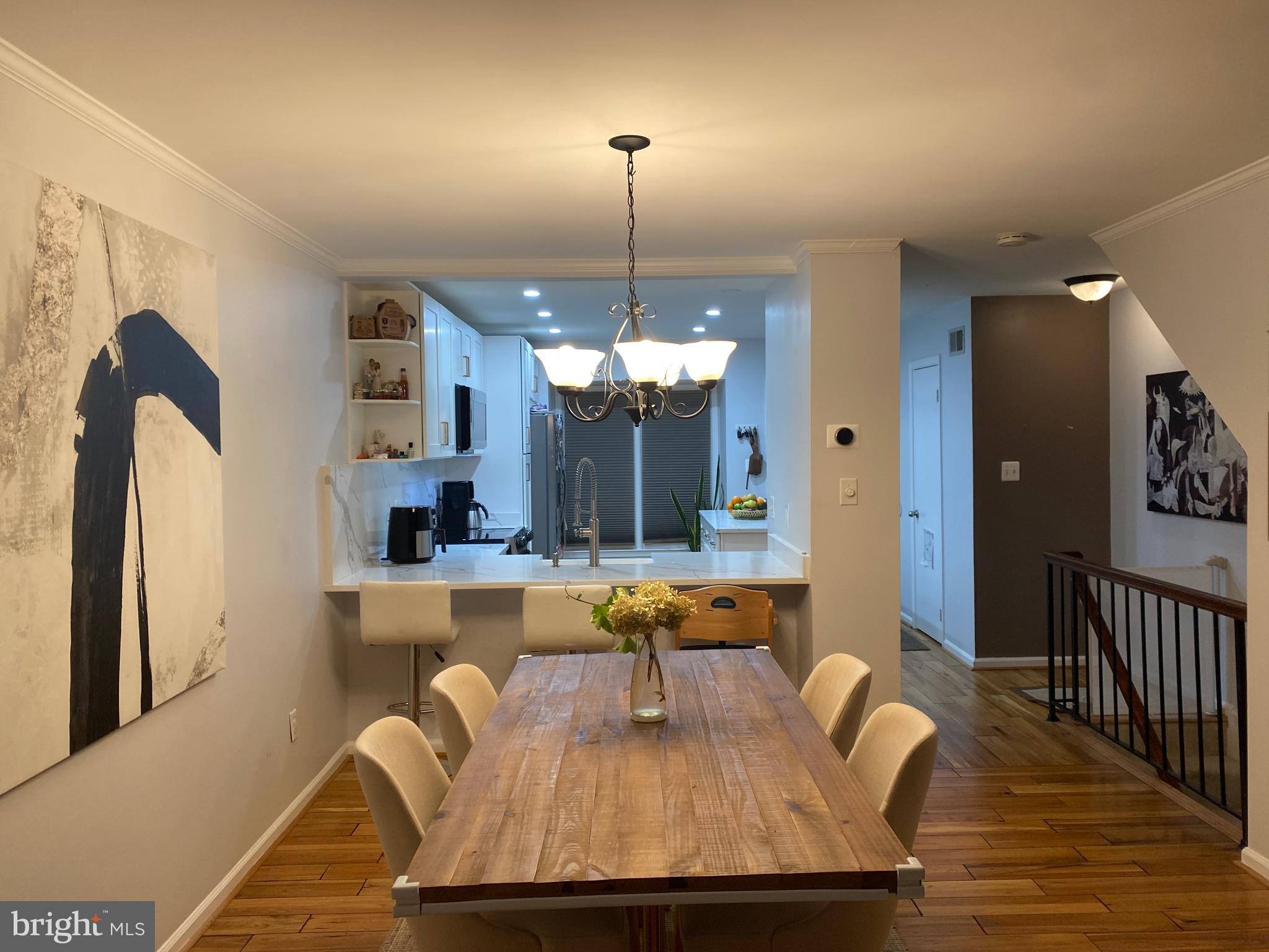 8523 Gambel Oak Drive Springfield, VA 22153 - Photo 39 of 41 a view of a dining room with furniture window and wooden floor