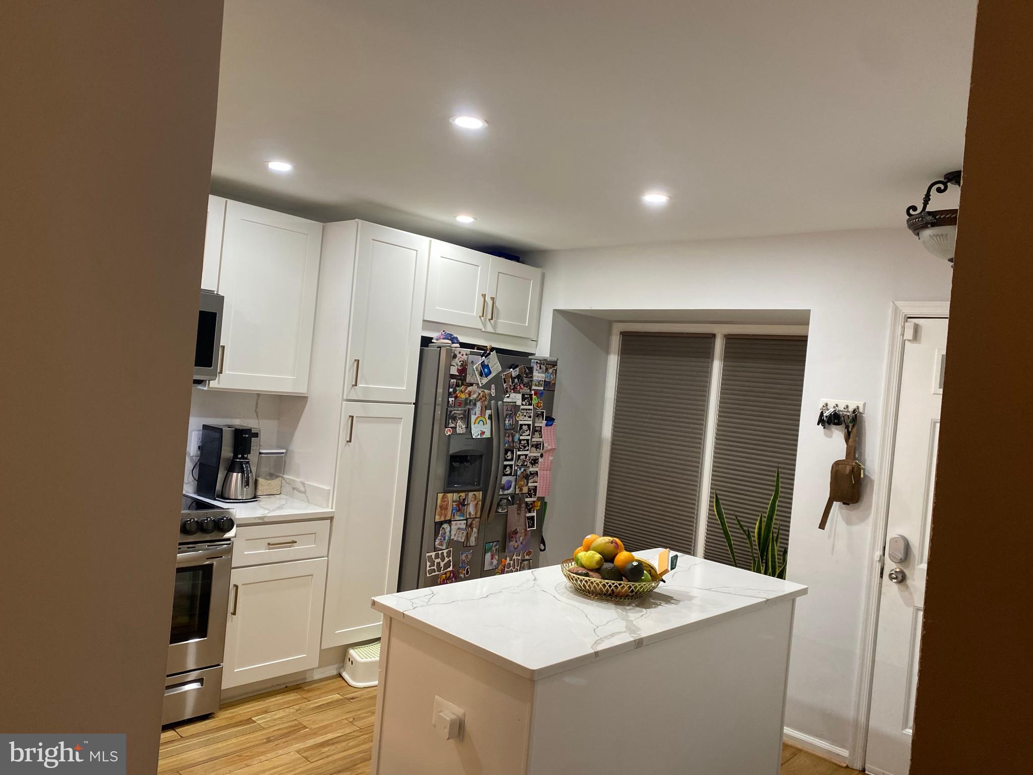 8523 Gambel Oak Drive Springfield, VA 22153 - Photo 41 of 41 a kitchen with a refrigerator and a stove top oven